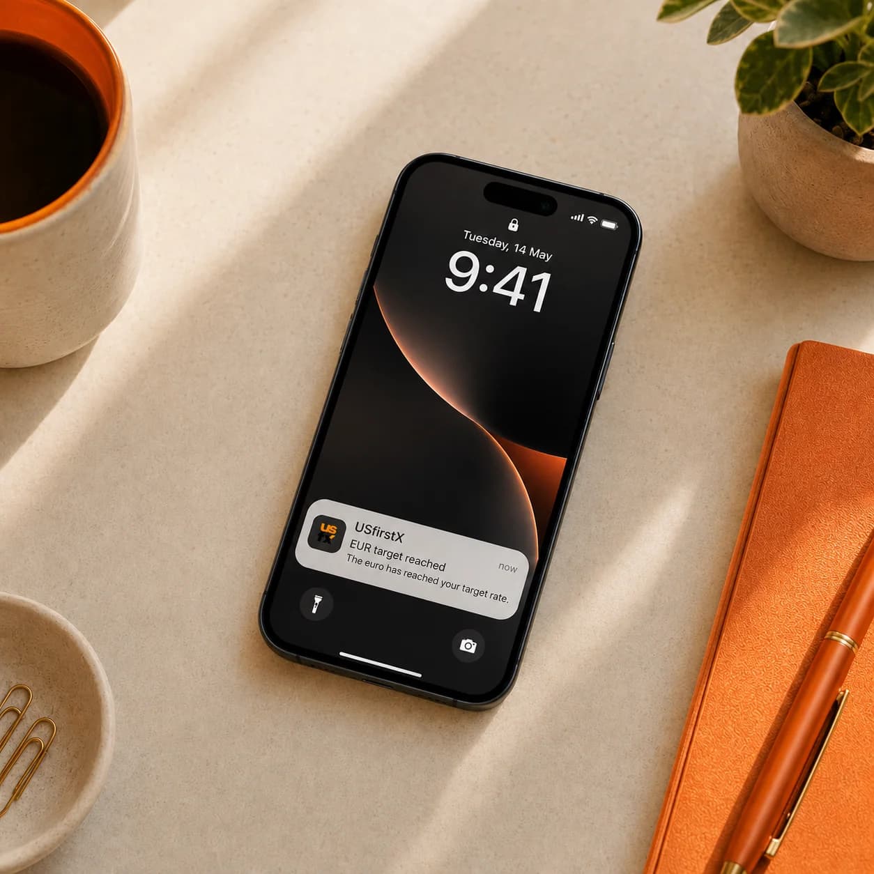 A phone showing a rate-alert notification