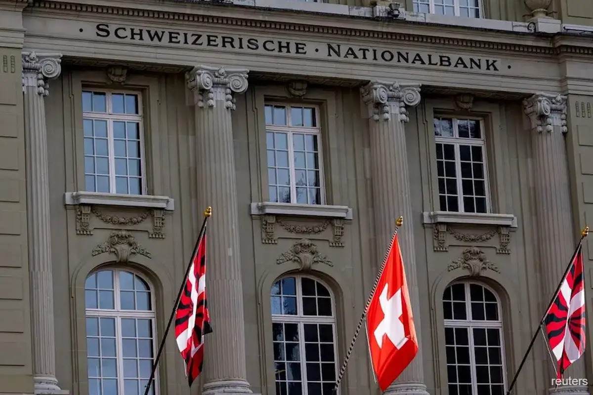 The Swiss National Bank building facade with columns and flags